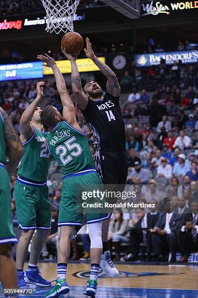 Nikola Pekovic of the Minnesota Timberwolves takes a shot against Chandler Parsons of the Dallas Mavericks in the first half at American Airlines...