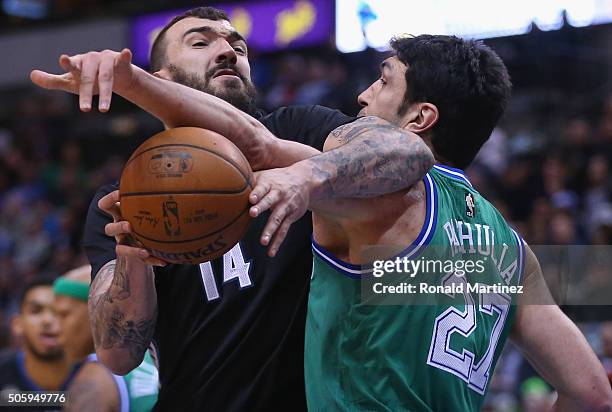 Nikola Pekovic of the Minnesota Timberwolves dribbles the ball against Zaza Pachulia of the Dallas Mavericks in the first half at American Airlines...