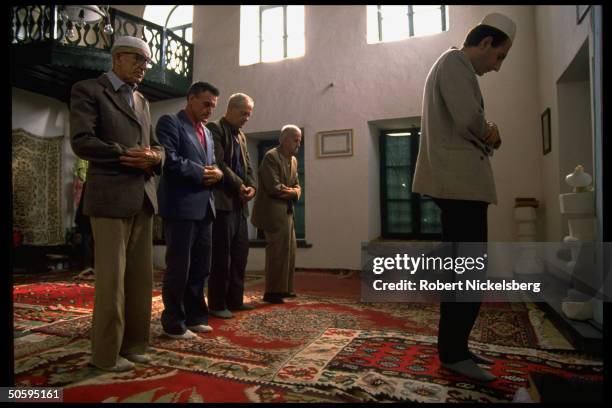 Muslim men at prayer at Tale Mosque, 1 of city's oldest, hit by grenade in Aug. Tri-ethnic civil war battle.