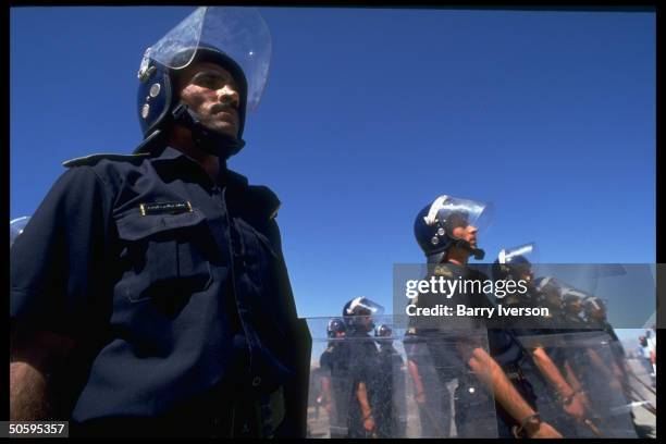 Future Palestinian police force under Israel/PLO Gaza Jericho autonomy peace plan training in riot control at Royal Police Academy.