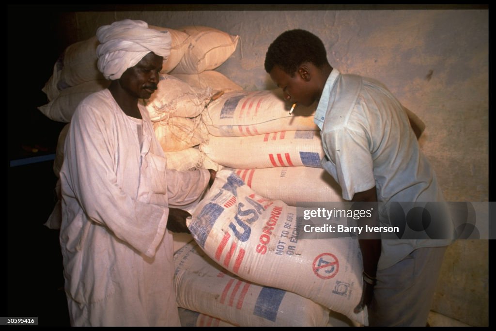 Bakery employees hefting sack labeled US