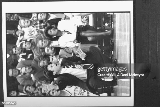 Bernadette Locke-Mattox, asst. Basketball coach at Univ. Of KY tensely holding clipboard while sitting on bench w. Asst. Coach Billy Donovan as head...