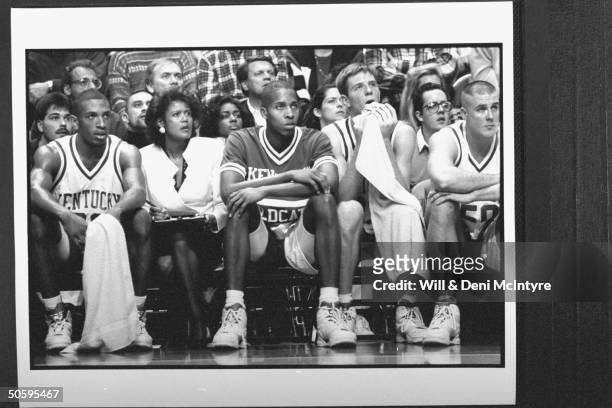 Bernadette Locke-Mattox, asst. Basketball coach at Univ. Of KY tensely holding clipboard while sitting on bench w. Players during game against TN at...