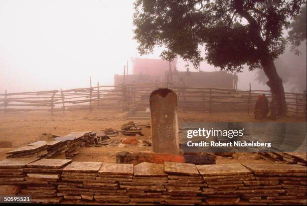 Paramil. Security framing piled tombstones at site of Dec. 6 Hindu militant-razed Babri mosque during 1st Hindu darshan allowed w. Curfew lift.