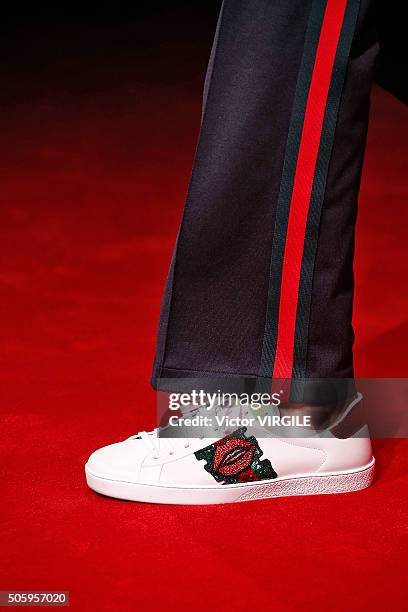 Model walks the runway at the Gucci show during Milan Men's Fashion Week Fall/Winter 2016/17 on January 18, 2016 in Milan, Italy.