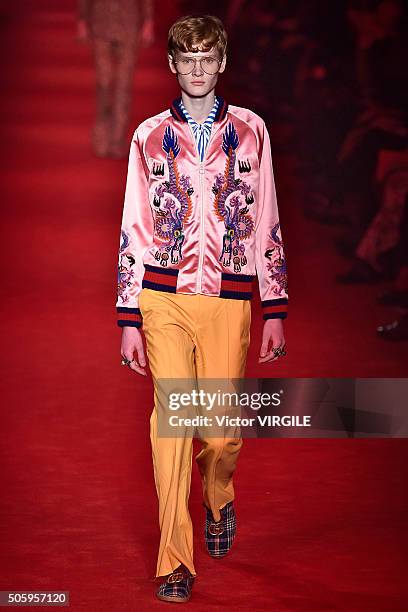 Model walks the runway at the Gucci show during Milan Men's Fashion Week Fall/Winter 2016/17 on January 18, 2016 in Milan, Italy.