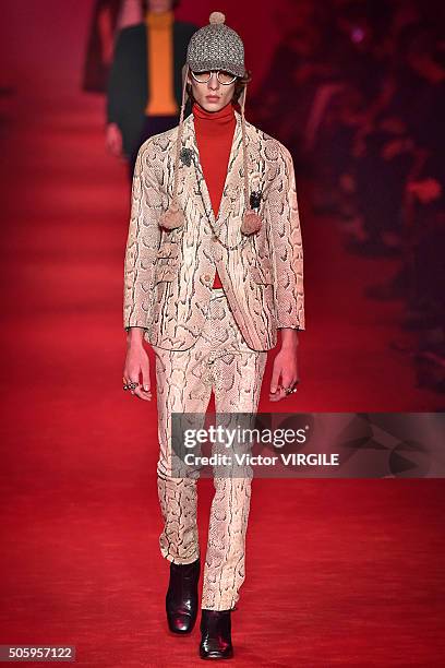 Model walks the runway at the Gucci show during Milan Men's Fashion Week Fall/Winter 2016/17 on January 18, 2016 in Milan, Italy.