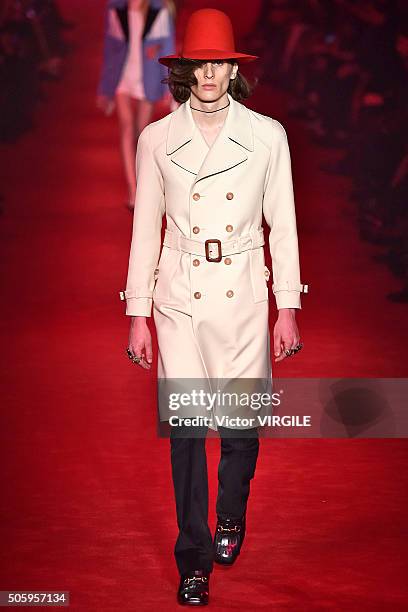 Model walks the runway at the Gucci show during Milan Men's Fashion Week Fall/Winter 2016/17 on January 18, 2016 in Milan, Italy.