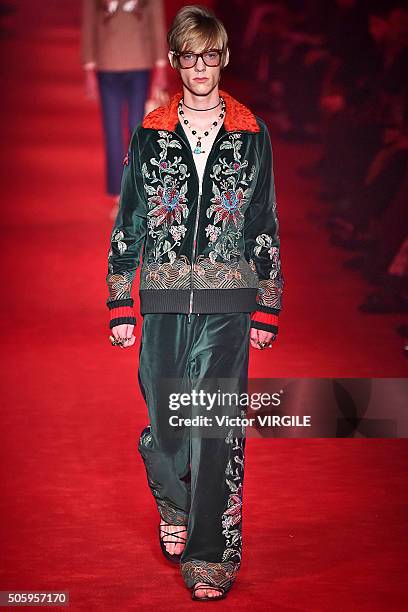 Model walks the runway at the Gucci show during Milan Men's Fashion Week Fall/Winter 2016/17 on January 18, 2016 in Milan, Italy.