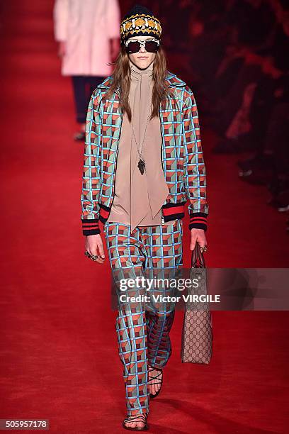 Model walks the runway at the Gucci show during Milan Men's Fashion Week Fall/Winter 2016/17 on January 18, 2016 in Milan, Italy.