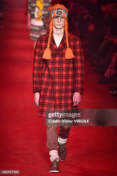 Model walks the runway at the Gucci show during Milan Men's Fashion Week Fall/Winter 2016/17 on January 18, 2016 in Milan, Italy.