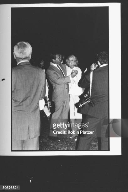 Arnold Schwarzenegger dancing w. Mother-in-law Eunice Shriver as her husband Sargent looks on at the Reebok party for Dem. Supporters during the wk....