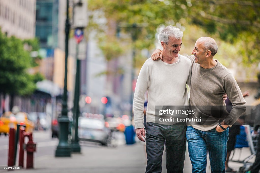 Gay couple walking in New York downtown