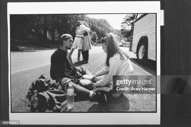 Hofstra Univ. Students Ronald Kasilag & Stephanie Prager playing the bongo drums, while School adminstrator Tamra hugs Gale Greenstein in the bkgrd....