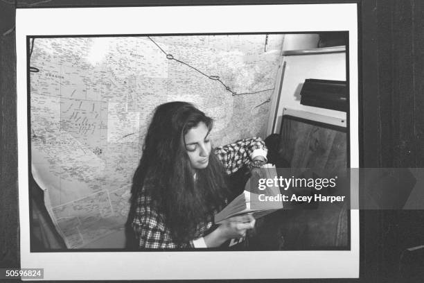 Hofstra Univ. Student Stephanie Prager reading bk. Aboard the Majic Bus; she is a member of Douglas Brinkley's An Amer. Odyssey: Art and Culture...