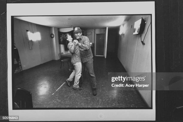 Hofstra Univ. Student Shana Westhoff dancing w. Local resident Marion Howard at bar; Shana is a member of prof Douglas Brinkley's An American...