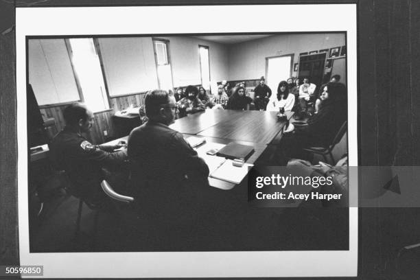 Forestry officials Mike Howe & Dave Drennan meeting at table w. A dozen or more Hofstra Univ. Students, who are protesting local logging policies;...