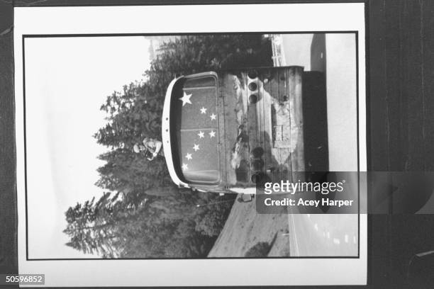 Hofstra Univ. Trip videographer Jared Goldman filming the scenery as he sits atop the emergency hatch of the Majic Bus as it rolls along highway 101;...