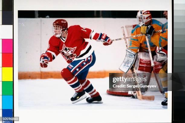 Red, white & blue-uniformed member of Russian Penguins ice hockey team during game at CSKA Arena, re new look for Penguins re Amer. Investing $1.2...