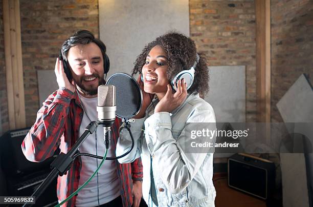 singers singing at a recording studio - duett bildbanksfoton och bilder