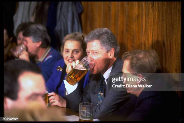 Pres. Bill Clinton sipping stein of beer while pub-hopping w. Czech Pres. Vaclav Havel & US UN Amb. Madeleine Albright during NATO summit trip stop.