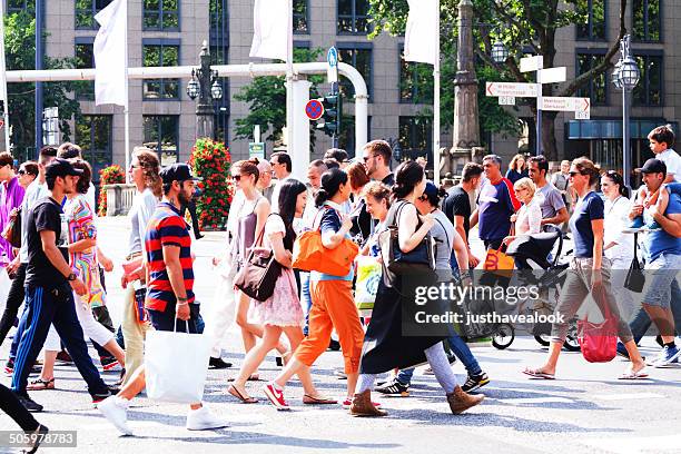 crowd is crossing street - dusseldorf germany stock pictures, royalty-free photos & images