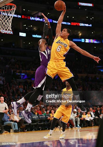 Jordan Clarkson of the Los Angeles Lakers goes up for a slam dunk against Ben McLemore of the Sacramento Kings in the second half during the NBA game...