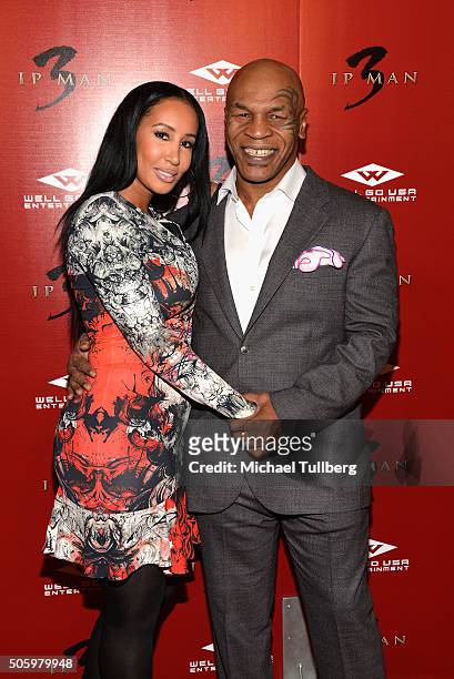 Former heavyweight boxing champion Mike Tyson and wife Kiki Tyson attend the premiere of Well Go USA's "Ip Man 3" at Pacific Theatres at The Grove on...