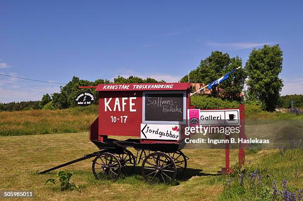 Advertising for coffe, cakes and strawberry.