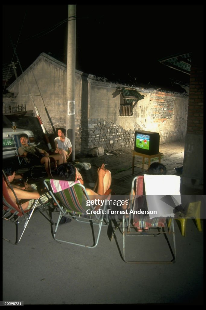 Neighbors watching World Cup soccer (bro