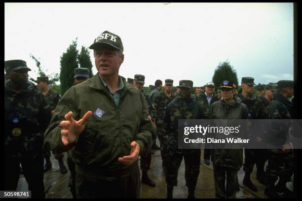 Olive drab-clad US Pres. Bill Clinton speaking while touring DMZ, US mil. Personnel in tow, during post-G7 summit trip to S. Korea.