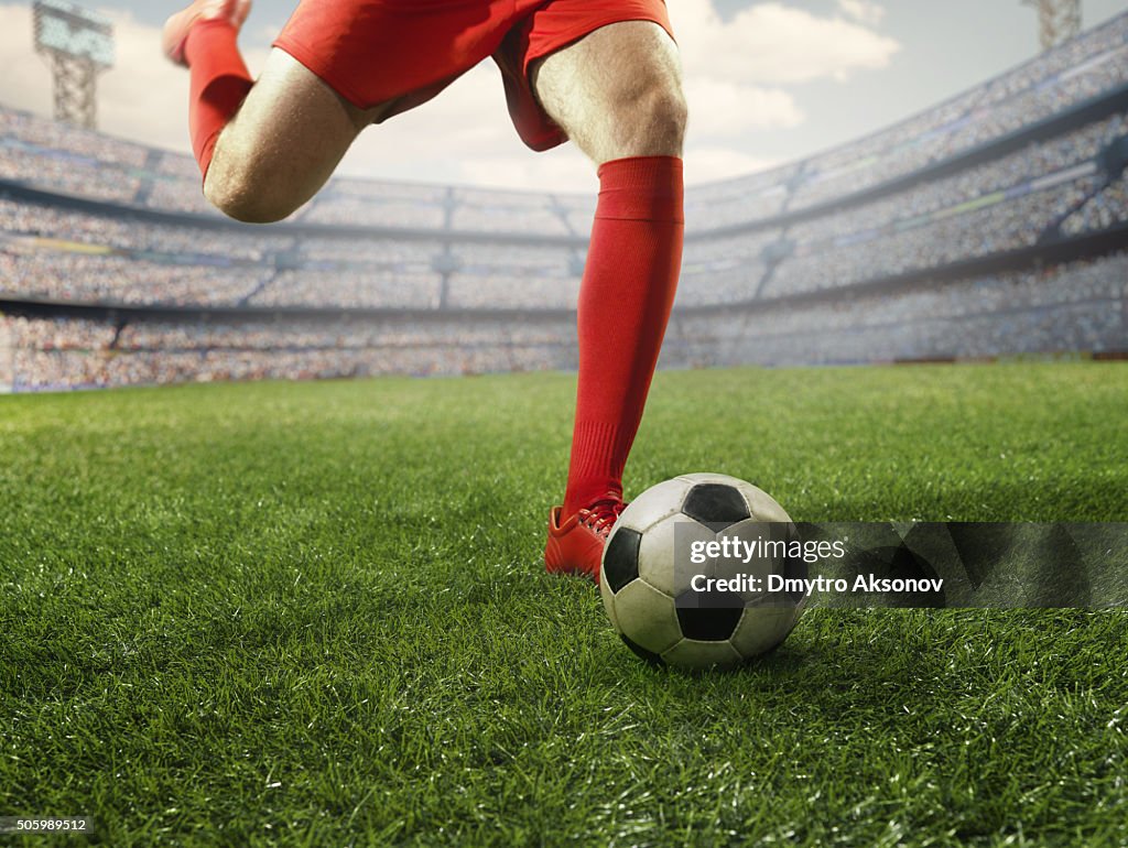 Soccer player kicking a ball