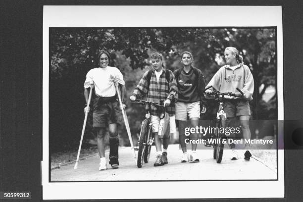 Univ. Of NC roommates & soccer teammates Tisha Venturini , Keri Sanchez, Mia Hamm & Angela Kelly walking to class together on the univ's campus;...