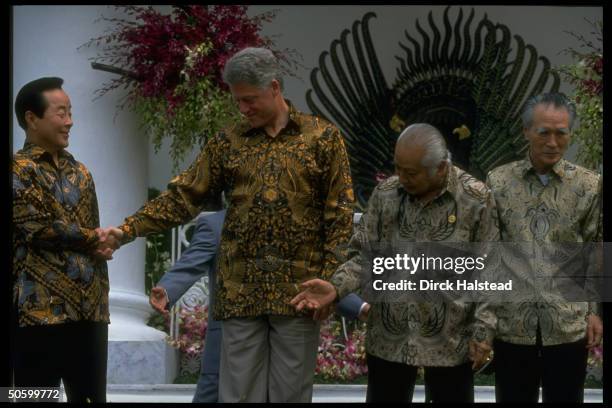 Batik-shirted APEC ldrs. Japan's Murayama, Indonesia's Suharto, Clinton & Kim Young Sam at summit of Asia-Pacific Economic Cooperation.