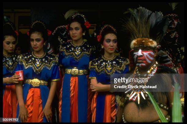 Indonesians in native dress during ceremonies surrounding APEC economic summit.