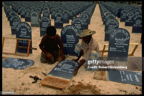 Workers preparing fresh graves at Tamil separatist Liberation Tigers of Tamil Eelam cemetery .