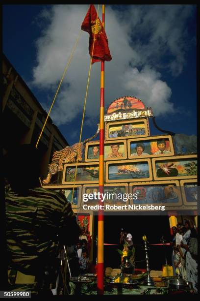 Flag-raising at shrine set up in wk-long memorial honoring Tamil separatist Liberation Tigers of Tamil Eelam dead in conflict w. Majority Sinhalese.