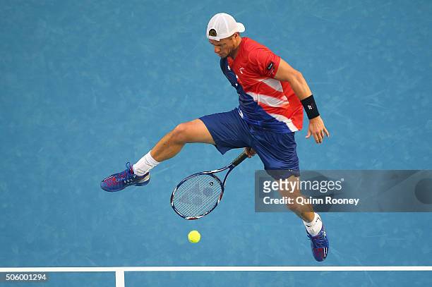 Lleyton Hewitt of Australia plays a shot between his legs in his second round match against David Ferrer of Spain during day four of the 2016...