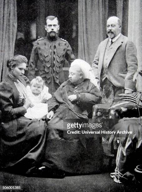 Photograph of Queen Victoria sat in the foreground alongside Tsarina Alexandra Fyodorovna and the infant Grand Duchess Olga Nikolaevna of Russia . In...