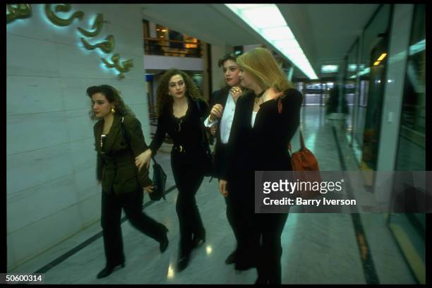 Lebanese college girl chums in sophisticated outfits on shopping jaunt, strolling hall in new, swanky upscale Verdun Plaza shopping mall.