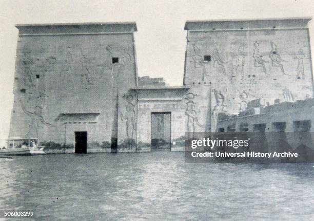 Photograph of the temple of Philae partly submerged by the waters of the Assuan Dam. The temple was constucted to celebrate the Goddess Isis. The...