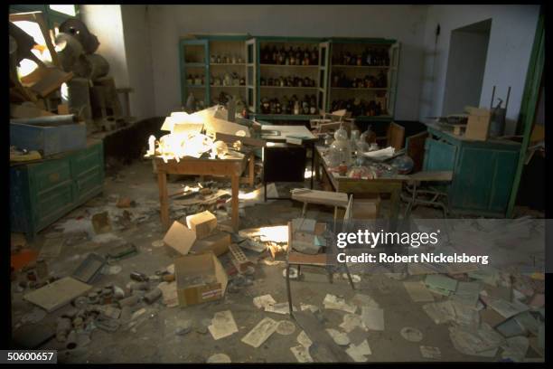 Trashed school-type chemistry lab , torn bks. Strewn on floor, in city under Taliban control, radical Islamic-cleric led faction threatening secular...