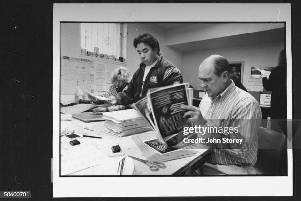 Three Strikes law crusader Mike Reynolds , the angry dad of murder victim Kimber Reynolds, rifling through petition posters as he works w. Volunteers...