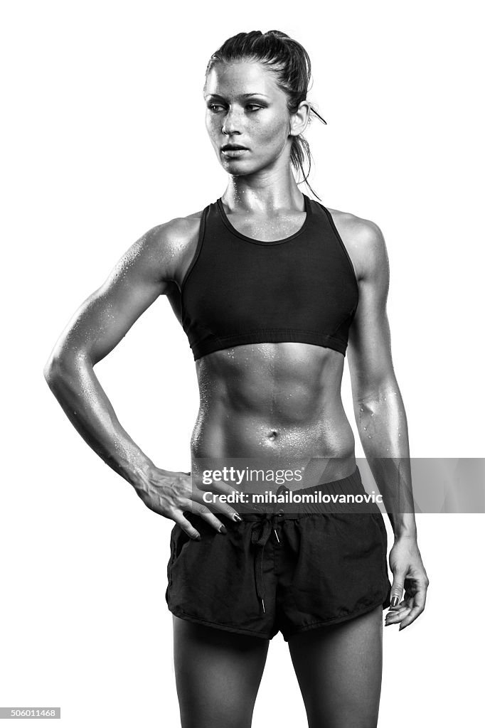 Fitness girl posing in studio