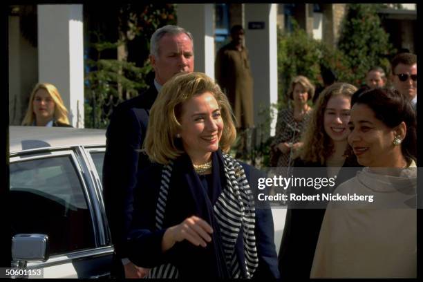 First Lady Hillary Rodham Clinton w. Daughter Chelsea & secret serviceman in tow, visiting college for girls, on Asian tour stop in Islamabad,...