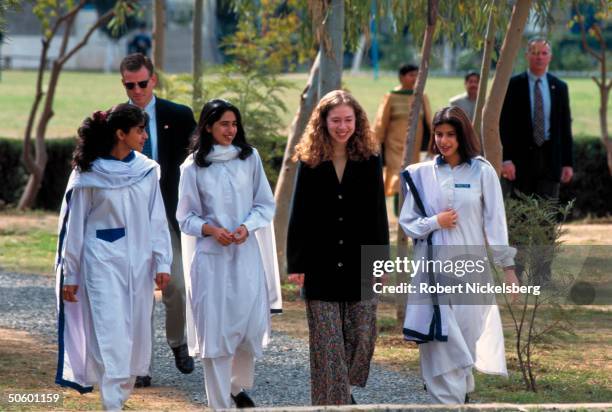 Chelsea Clinton strolling w. Students on campus, visiting college for girls, on Asian tour w. Her US 1st Lady mom.
