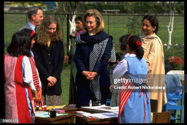 First Lady Hillary Rodham Clinton and daughter Chelsea, visiting a college for girls in Islamabad, Pakistan.