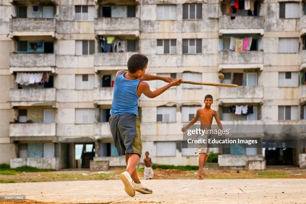 Cuba. Baracoa. Malecon. Kids Playing Baseball