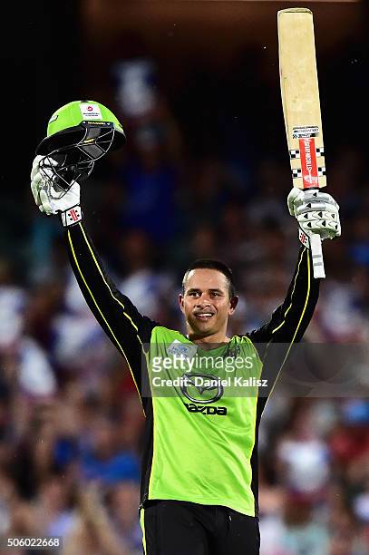 Usman Khawaja of the Sydney Thunder reacts after reaching his century during the Big Bash League Semi Final match between the Adelaide Strikers and...