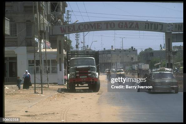 Traffic passing through welcome to Gaza Traffic passing through welcome to Gaza